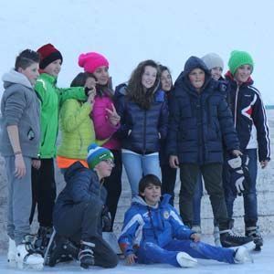 Group of guys on the Delbono mountain rent skating rink